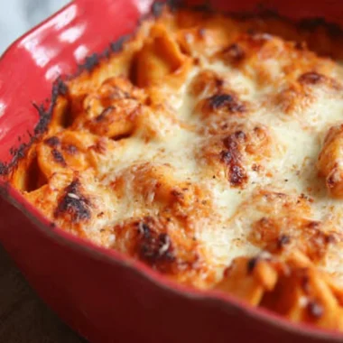 Baked Tortellini with cheese and sauce in a casserole dish