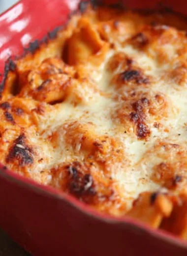 Baked Tortellini with cheese and sauce in a casserole dish