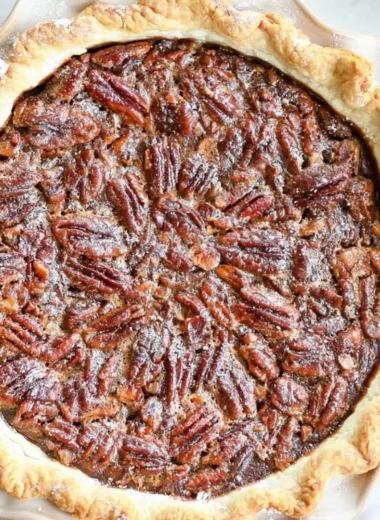 Delicious homemade chocolate pecan pie with a flaky crust and rich filling.