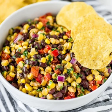 Delicious black bean and corn salsa in a bowl with fresh ingredients