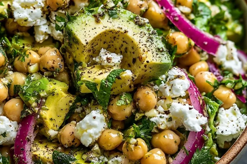 Chickpea Feta Avocado Salad with fresh vegetables and a drizzle of dressing