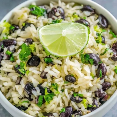 Cilantro lime rice served with black beans and fresh lime slices