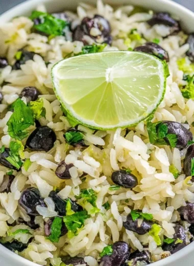 Cilantro lime rice served with black beans and fresh lime slices