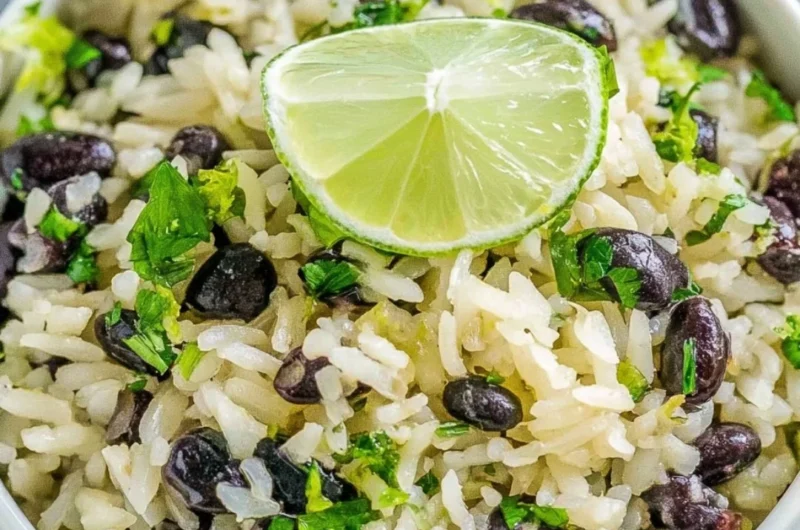 Cilantro lime rice served with black beans and fresh lime slices