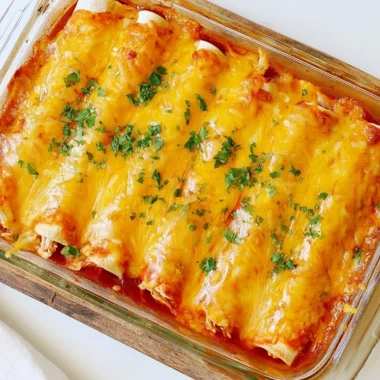 Delicious easy chicken sour cream enchiladas on a white plate