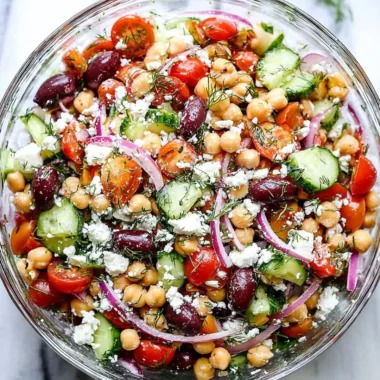 Bowl of Greek Chickpea Salad with fresh vegetables and feta cheese
