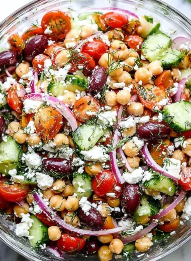 Bowl of Greek Chickpea Salad with fresh vegetables and feta cheese