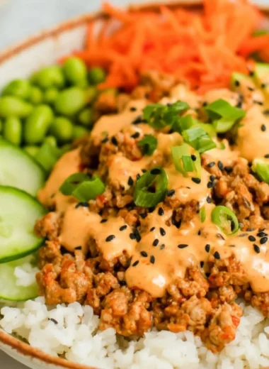 Ground turkey rice bowl served with Bang Bang sauce and colorful veggies