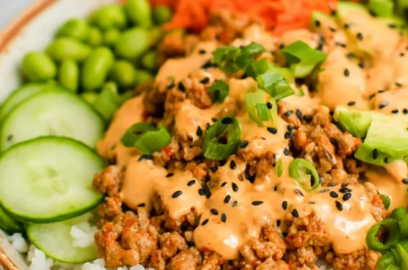 Ground turkey rice bowl served with Bang Bang sauce and colorful veggies