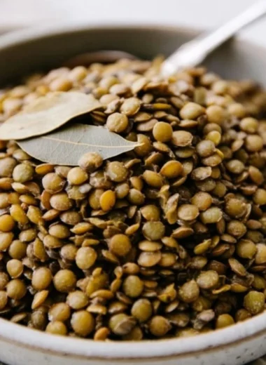 Bowl of perfectly cooked lentils with herbs and spices for a healthy meal