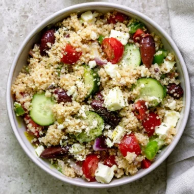 Colorful Mediterranean Quinoa Salad with tomatoes, cucumbers, and olives