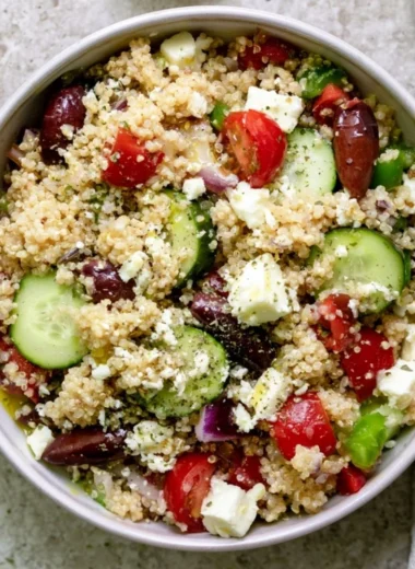 Colorful Mediterranean Quinoa Salad with tomatoes, cucumbers, and olives