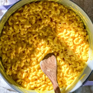 One pot creamy mac and cheese served in a bowl, garnished with herbs