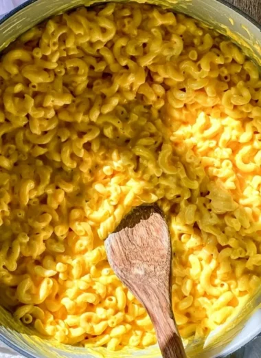 One pot creamy mac and cheese served in a bowl, garnished with herbs