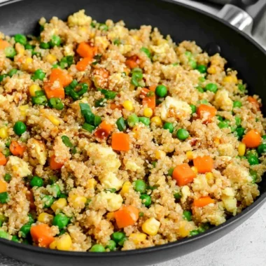 Quinoa fried rice with colorful vegetables in a bowl