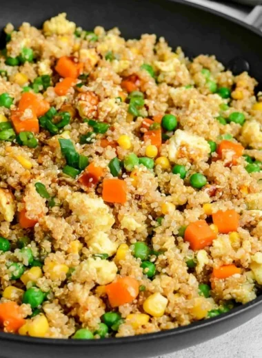 Quinoa fried rice with colorful vegetables in a bowl