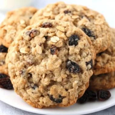 Delicious soft and chewy oatmeal raisin cookies on a plate