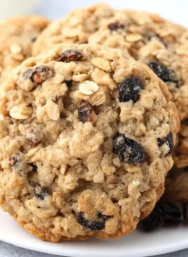 Delicious soft and chewy oatmeal raisin cookies on a plate