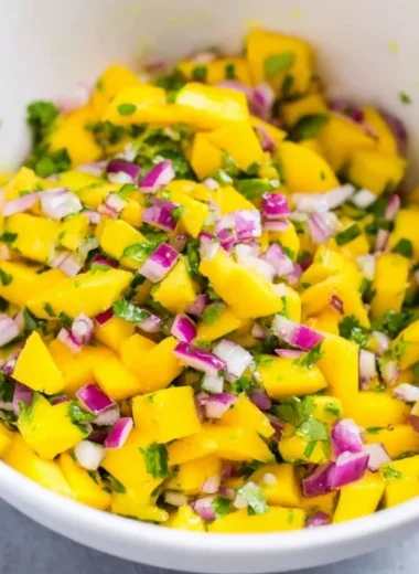 Fresh mango salsa made with ripe mangoes, cilantro, and lime