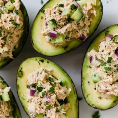 Tuna stuffed avocados served on a plate, highlighting a healthy meal option.