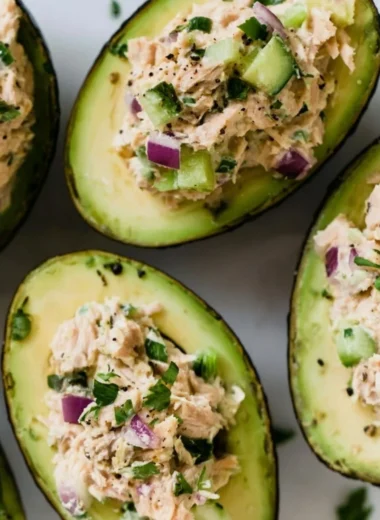 Tuna stuffed avocados served on a plate, highlighting a healthy meal option.