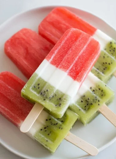 Fresh homemade watermelon popsicles on a sunny day