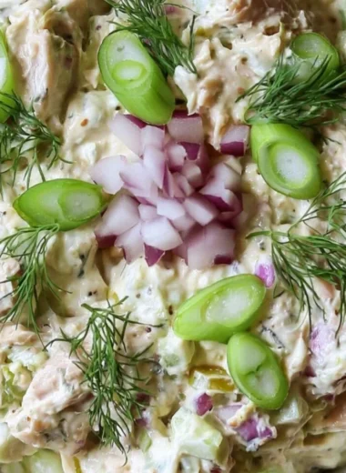 Cottage Cheese Tuna Salad garnished with fresh herbs on a plate.