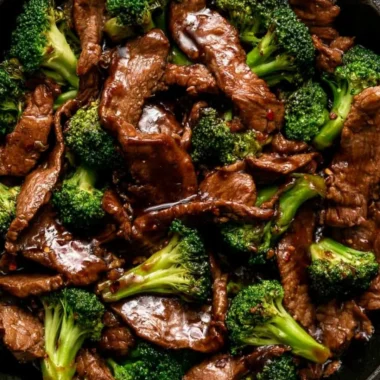 Delicious beef and broccoli stir-fry served with rice in a cozy setting.
