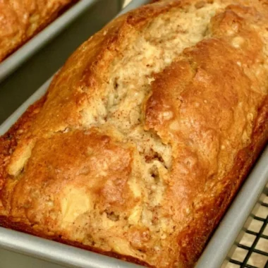 Delicious slice of cozy easy apple bread on a rustic wooden table