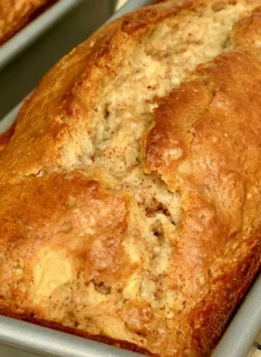 Delicious slice of cozy easy apple bread on a rustic wooden table