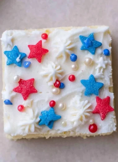 Cozy patriotic sugar cookie bars topped with red, white, and blue sprinkles.