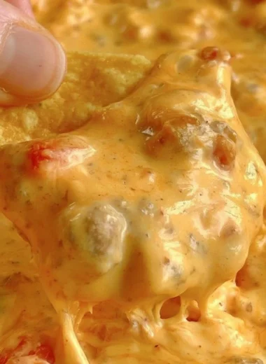 A bowl of delicious and easy queso dip served with tortilla chips.