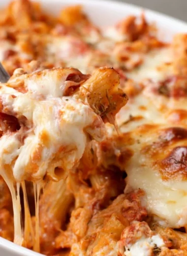 Delicious easy baked ziti with cheese and marinara sauce in a baking dish