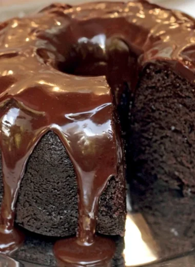 Famous Brick Street Chocolate Cake topped with chocolate frosting and decoration