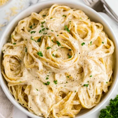 Homemade Alfredo sauce in a saucepan ready to serve with pasta.