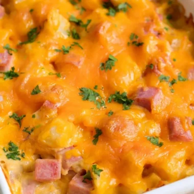Cheesy ham and potato casserole served in a baking dish