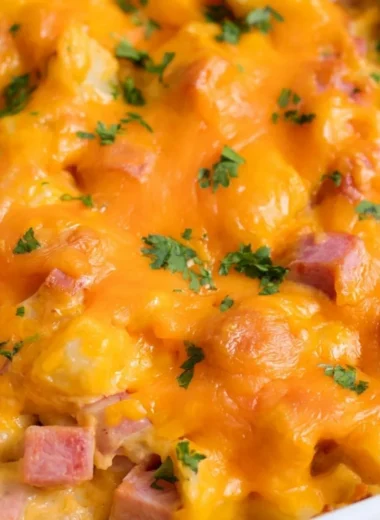 Cheesy ham and potato casserole served in a baking dish