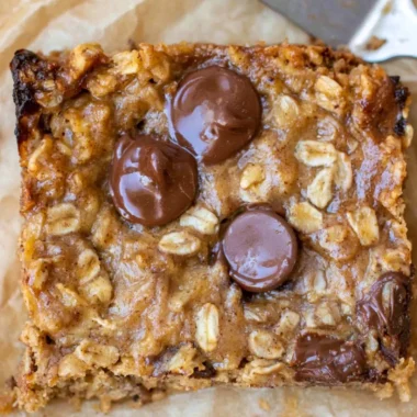 Homemade cozy banana oatmeal bars on a wooden table
