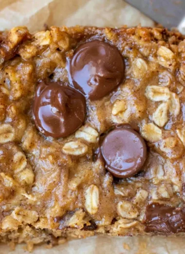 Homemade cozy banana oatmeal bars on a wooden table