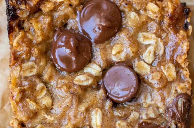 Homemade cozy banana oatmeal bars on a wooden table