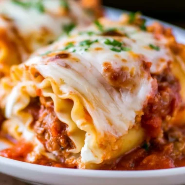 Delicious cozy lasagna roll ups baked with cheese and marinara sauce