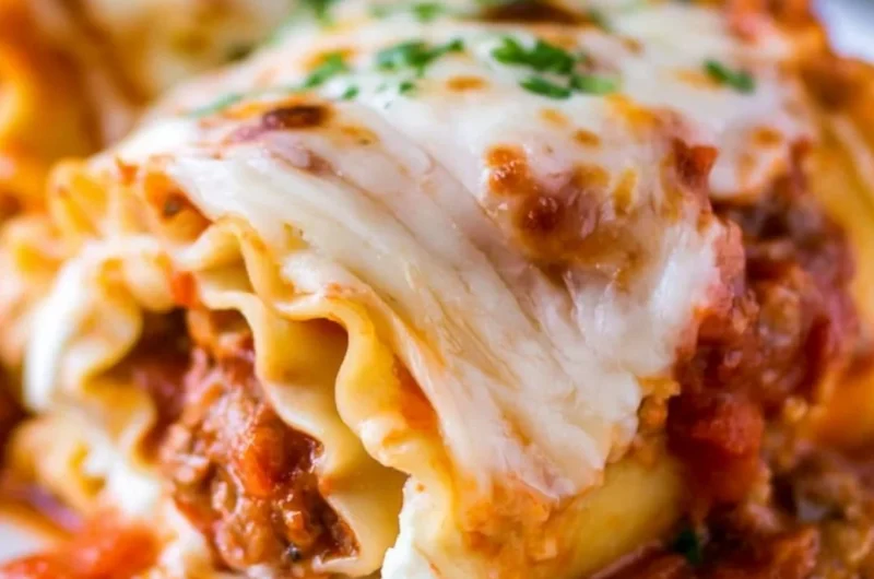 Delicious cozy lasagna roll ups baked with cheese and marinara sauce