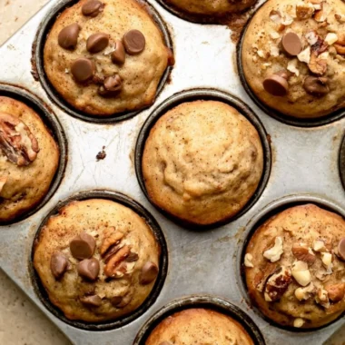 Cozy mini banana muffins fresh out of the oven, golden and delicious.