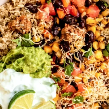 Delicious quinoa taco bowl with fresh toppings and vibrant colors.