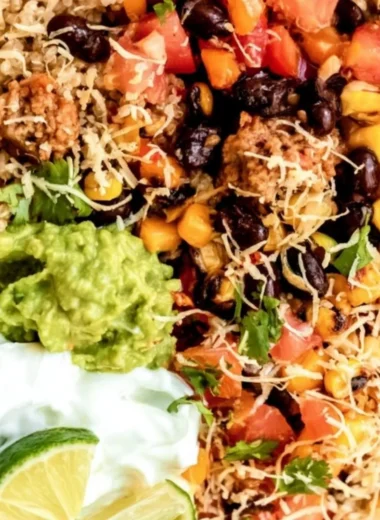 Delicious quinoa taco bowl with fresh toppings and vibrant colors.