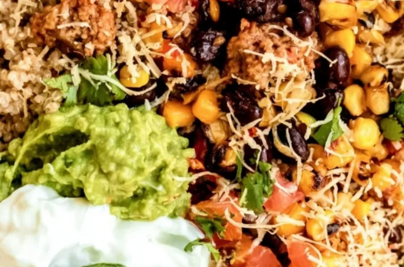 Delicious quinoa taco bowl with fresh toppings and vibrant colors.