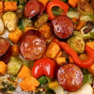 Delicious cozy sheet pan dinner featuring roasted vegetables and chicken.