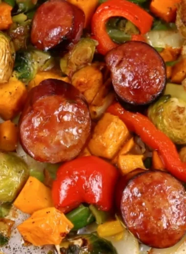 Delicious cozy sheet pan dinner featuring roasted vegetables and chicken.