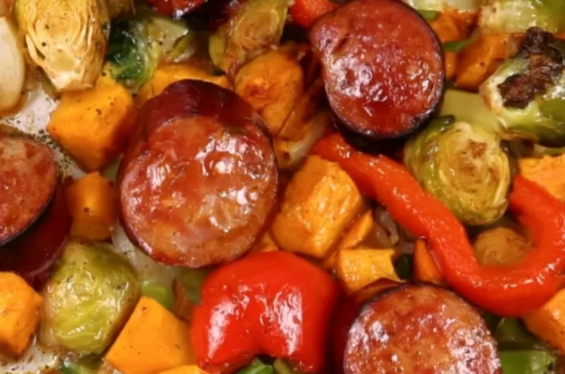 Delicious cozy sheet pan dinner featuring roasted vegetables and chicken.