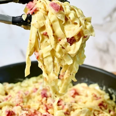 Creamy cabbage carbonara dish garnished with parsley and cheese